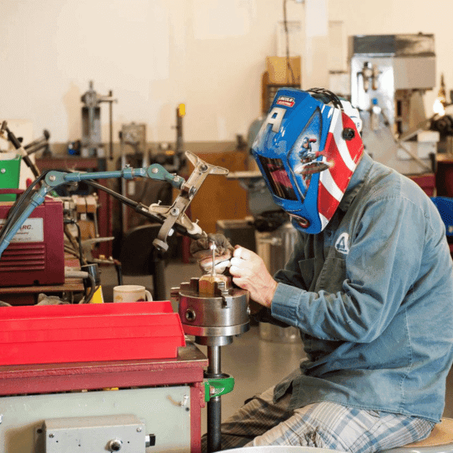 Intempco employee working on fine tuning a custom sensor. 